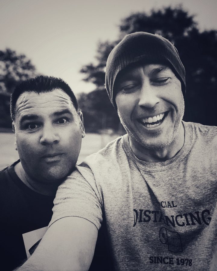 Nate and a friend goofing around, black and white